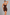Sculp seamless full body shaper bodysuit in Brown – front view, criss-cross tummy panel