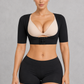 Sculp Upper Arm Shaper Top in Black – front view, worn over a bra