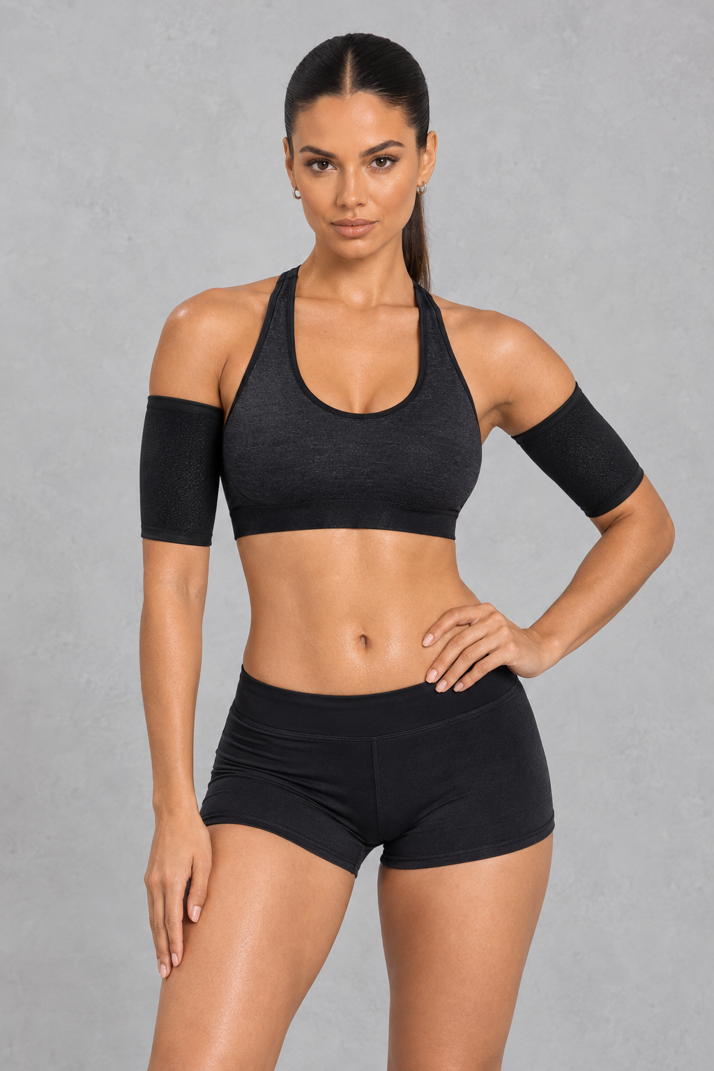 Sculp Sauna Arm Shaper Band in Black – front view, worn on both upper arms