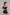 Sculp Sauna Arm Shaper Band in Black – back view, worn on both upper arms