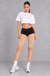 Sculp Thigh Compression Sleeves in Nude – front view, worn on both thighs