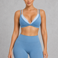 Sculp Low Back Push-Up Sports Bra in Blue – front view, plunge V-neck with light blue contrast trim