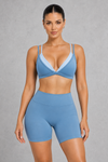 Sculp Low Back Push-Up Sports Bra in Blue – front view, plunge V-neck with light blue contrast trim