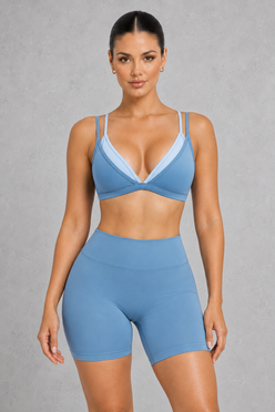 Sculp Low Back Push-Up Sports Bra in Blue – front view, plunge V-neck with light blue contrast trim