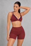 Sculp Low Back Push-Up Sports Bra in Rose – front view, plunge V-neck with plum contrast trim