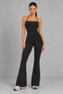 Sculp flare leg gym jumpsuit in black, front view