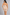 Sculp strapless mid-thigh shapewear bodysuit in nude, back view showing the bum-lift shaping