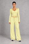 Sculp Wrap Top & Wide Leg Joggers Lounge Set in Light Yellow – front view with tie-front wrap top