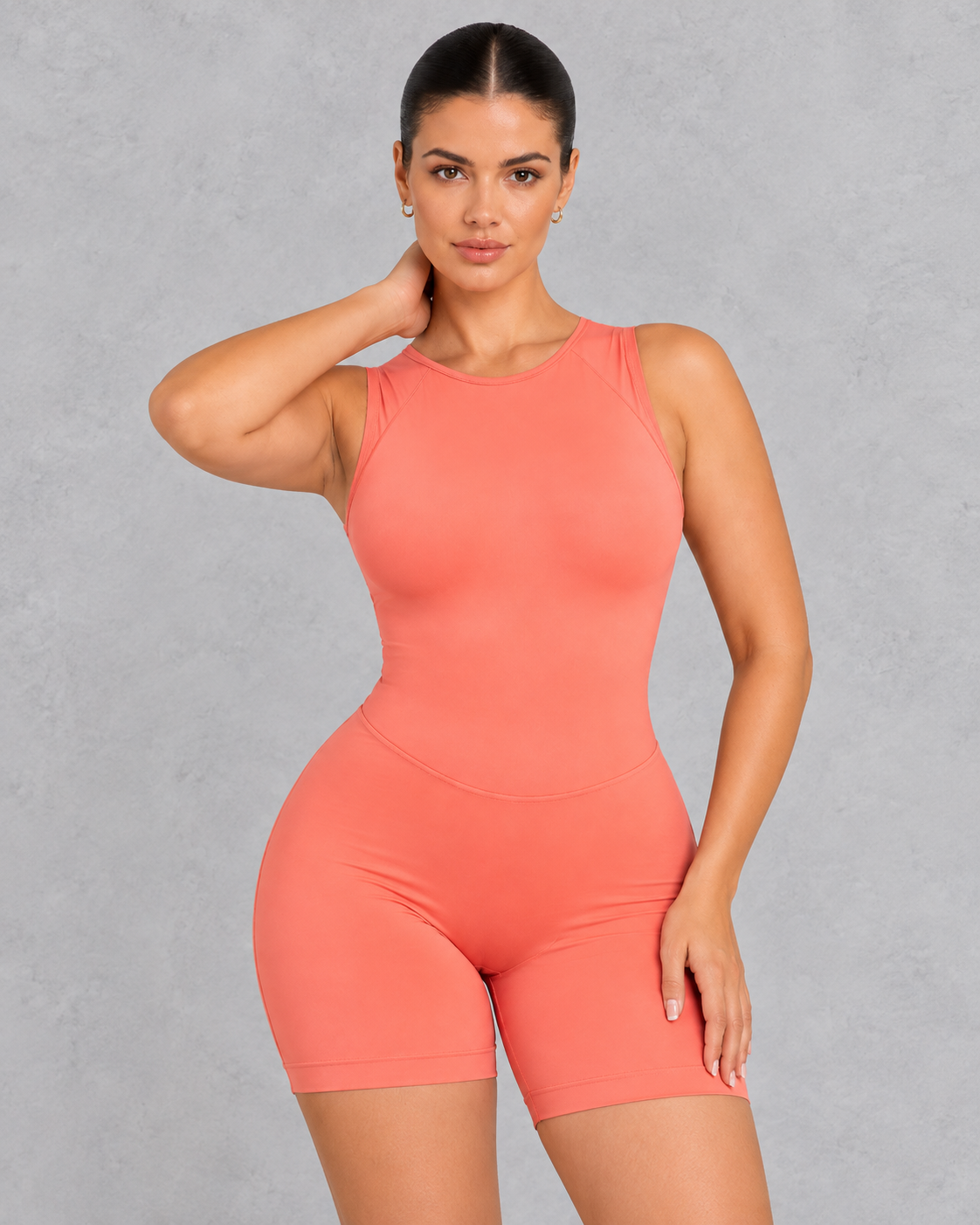 Sleeveless open back gym unitard with mid-thigh shorts