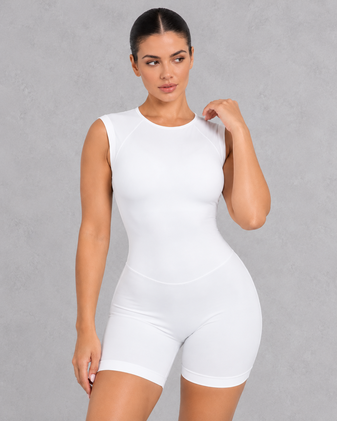Sleeveless open back gym unitard with mid-thigh shorts