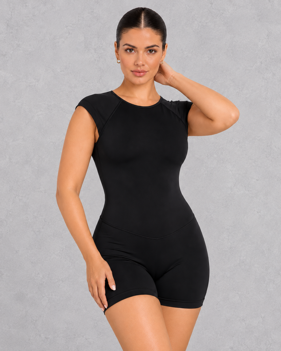 Sleeveless open back gym unitard with mid-thigh shorts