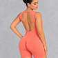 Sleeveless open back gym unitard with mid-thigh shorts