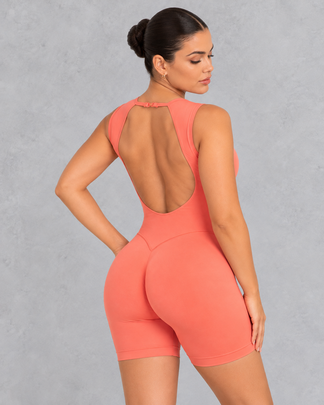 Sleeveless open back gym unitard with mid-thigh shorts