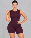 Sleeveless open back gym unitard with mid-thigh shorts