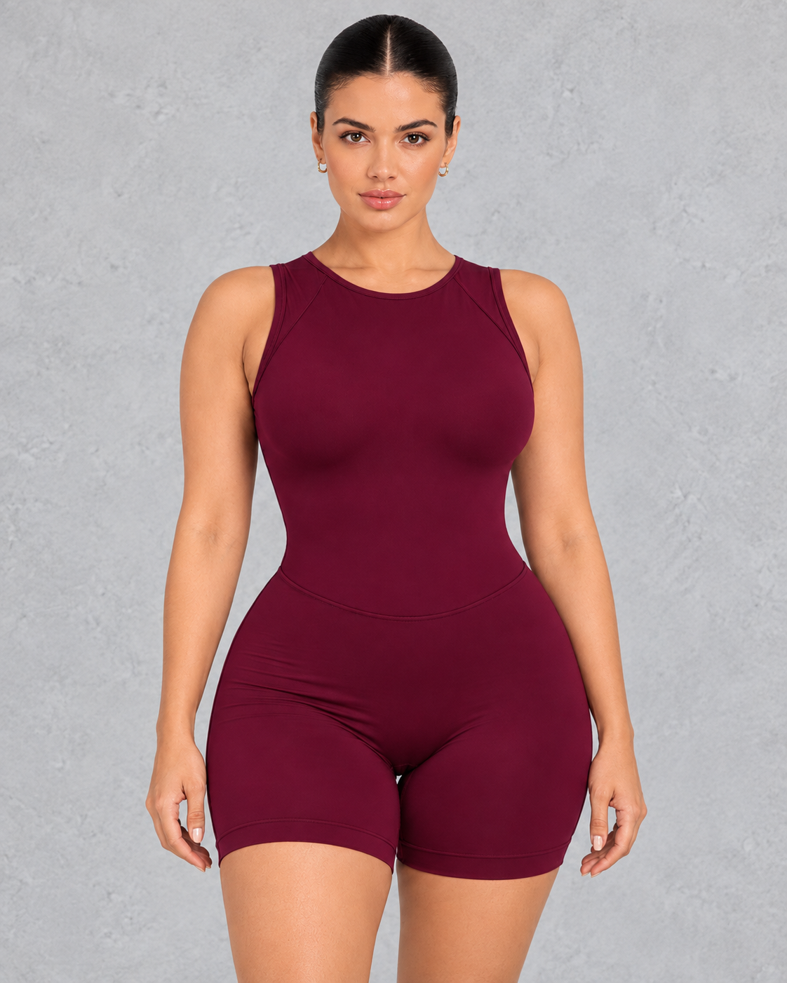 Sleeveless open back gym unitard with mid-thigh shorts