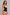 A woman modeling a black structured waist trainer corset over a beige bra and matching beige underwear, photographed against a plain light gray studio background.
