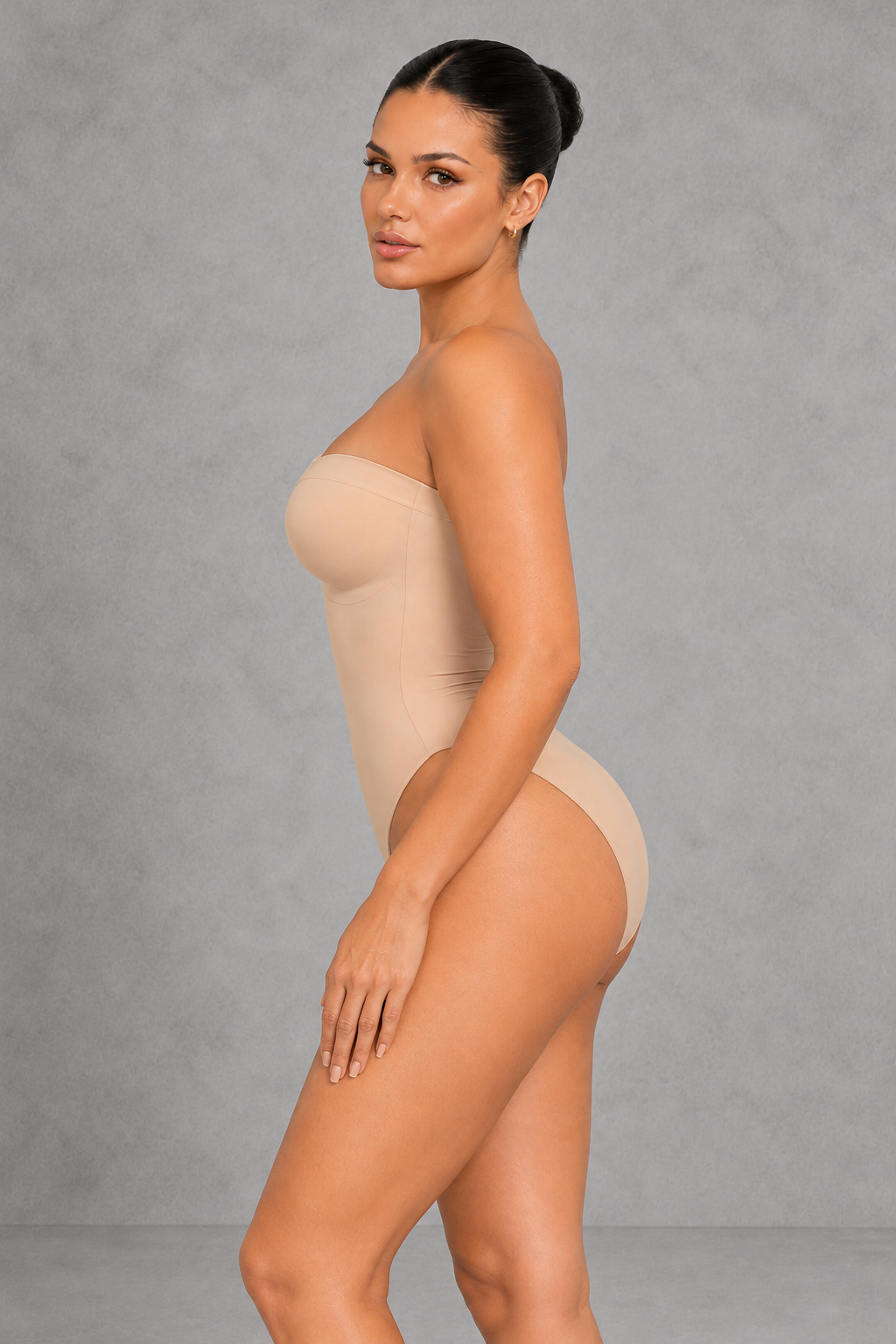 Sculp strapless high-leg compression bodysuit in nude, side view showing the bum-lift back
