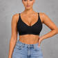 Sculp ice silk seamless wireless bra in black worn with jeans