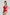 Woman wearing a red swimsuit against a plain background