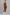 Sculp front zip gym jumpsuit in brown, front view