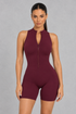 Sculp open back zip gym romper in burgundy, front view