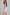 Sculp shapewear bodysuit in sky blue, side view showing seamless tummy and bum shaping