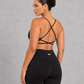 Sculp twist front sports bra in black, detail view