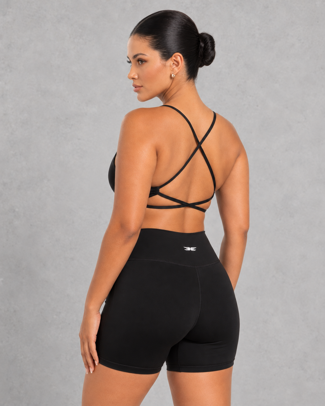 Sculp twist front sports bra in black, detail view