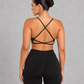 Sculp twist front sports bra in black, detail view