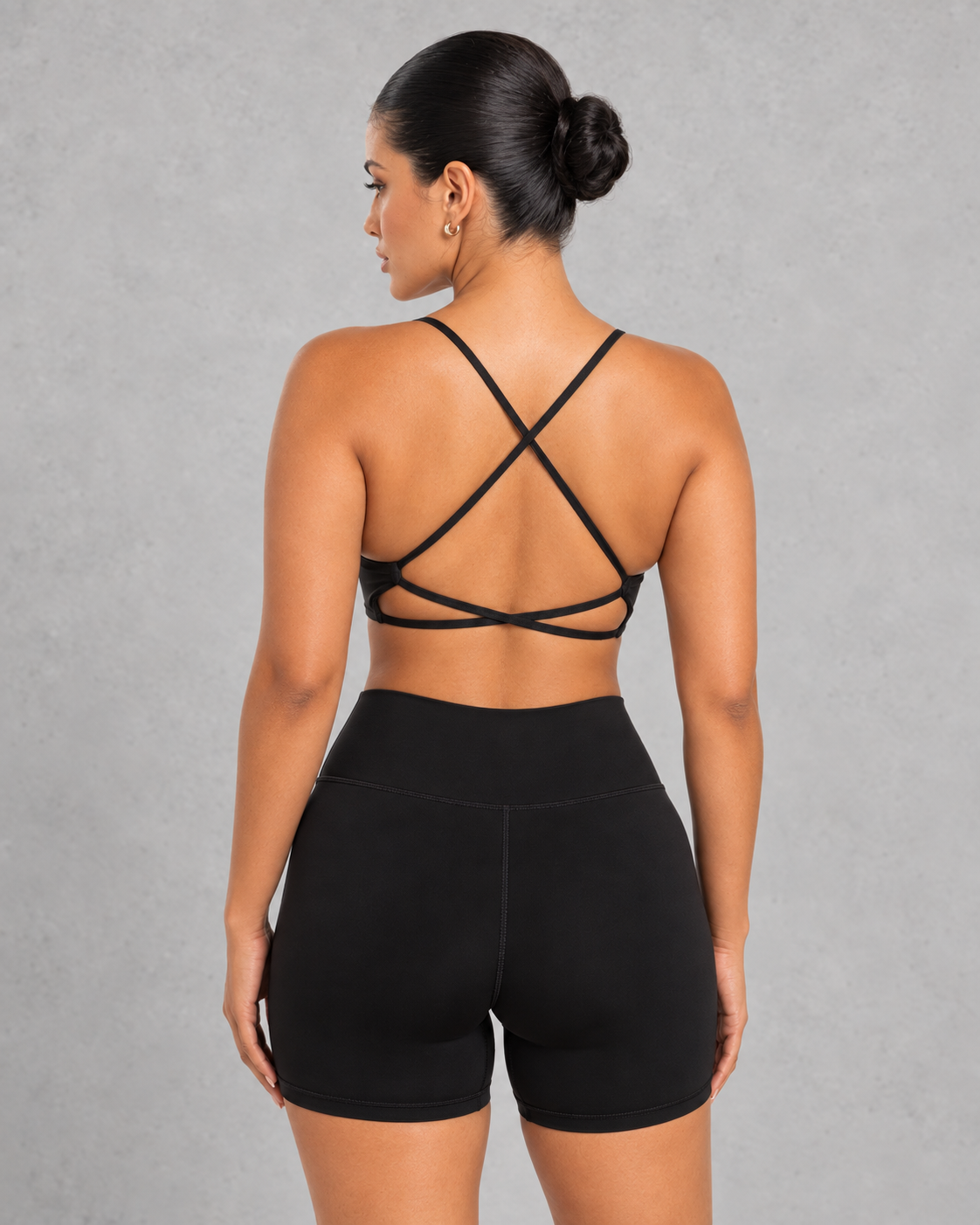 Sculp twist front sports bra in black, detail view