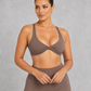 Sculp twist front sports bra in chestnut brown, front view