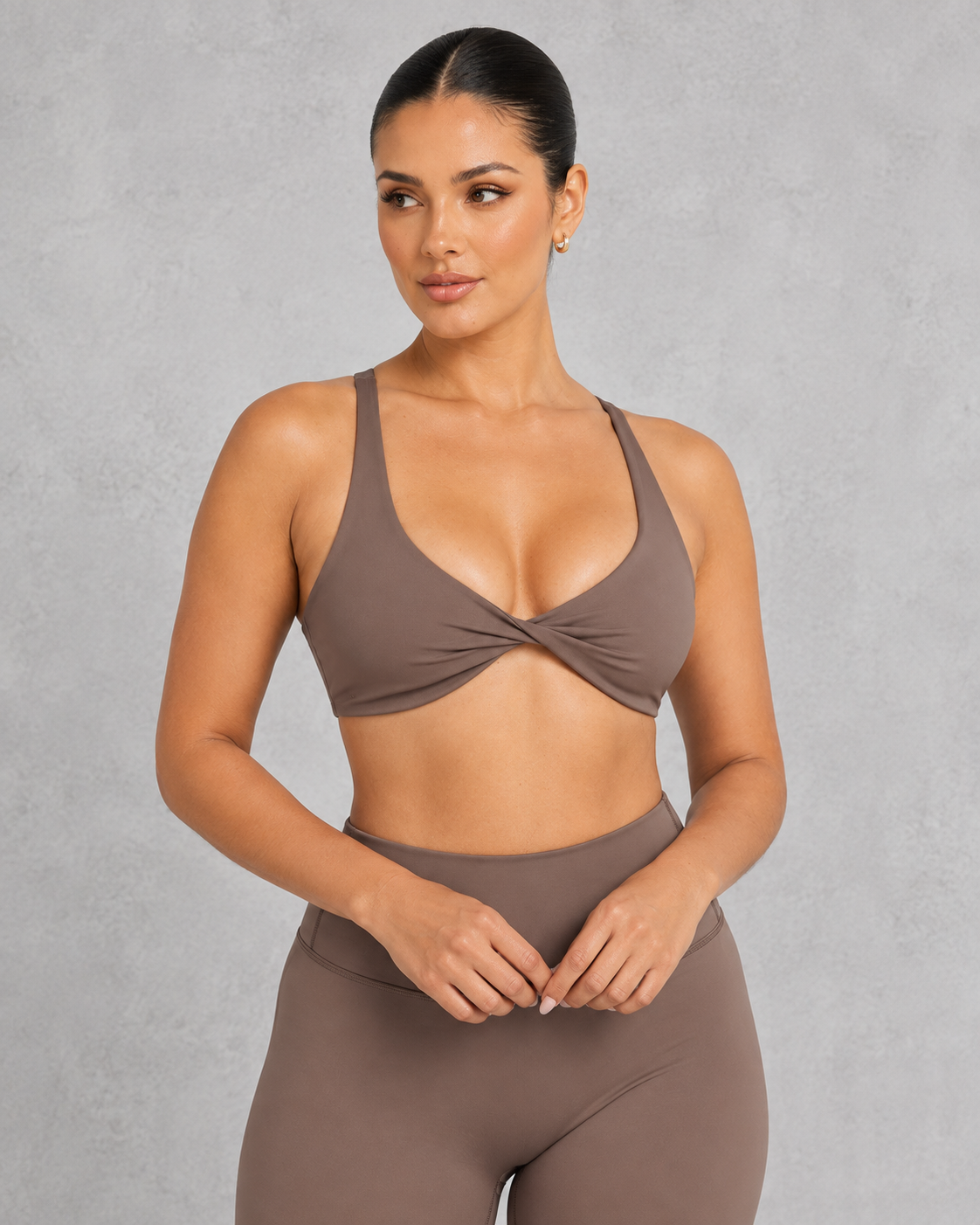 Sculp twist front sports bra in chestnut brown, front view