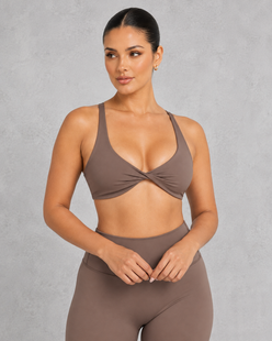 Sculp twist front sports bra in chestnut brown, front view