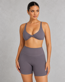 Sculp twist front sports bra in gray, front view