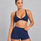 Sculp twist front sports bra in navy blue, front view