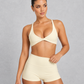Sculp twist front sports bra in washed yellow, front view