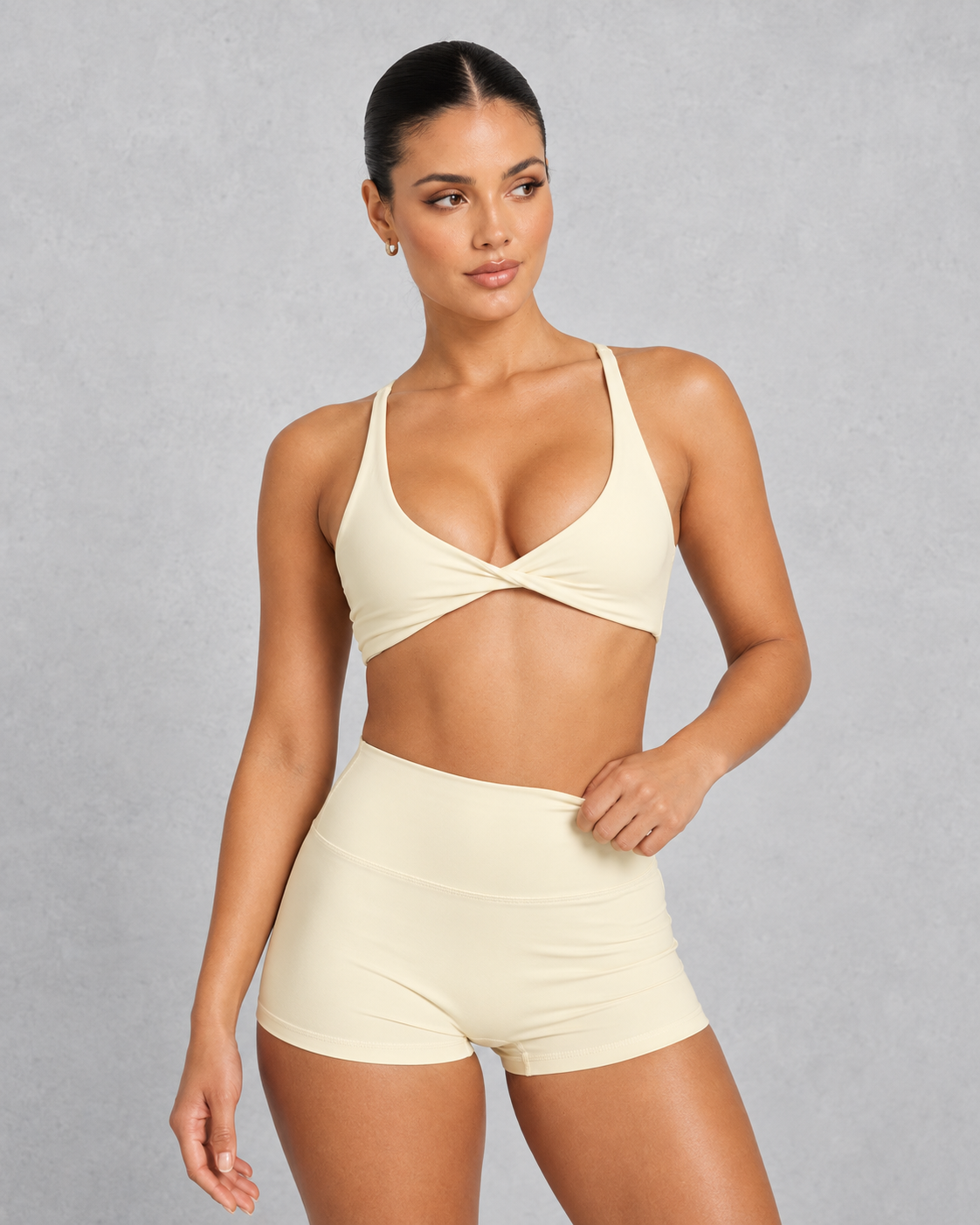 Sculp twist front sports bra in washed yellow, front view
