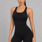 Sculp zip-front racerback gym romper in black, front view