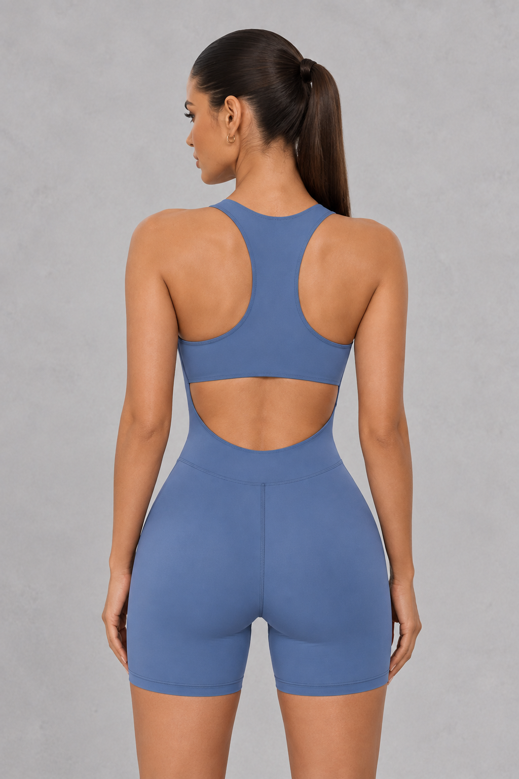 Sculp zip-front racerback gym romper in blue, detail view