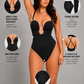 A woman modeling a black one-piece swimsuit with a deep V-neckline and front keyhole cutout, shown on a gray background with six callout circles and text describing features such as thong design, adjustable crotch closure, and one-piece bra support.