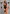A woman modeling a black one-piece swimsuit with a deep V-neckline and front keyhole cutout, shown on a gray background with six callout circles and text describing features such as thong design, adjustable crotch closure, and one-piece bra support.